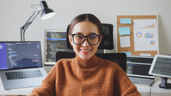 IT administrator smiling into camera